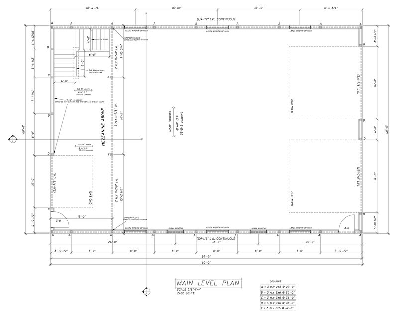 Main level plan of a pole barn showing column layout, two overhead doors, stairs and the mezzanine above
